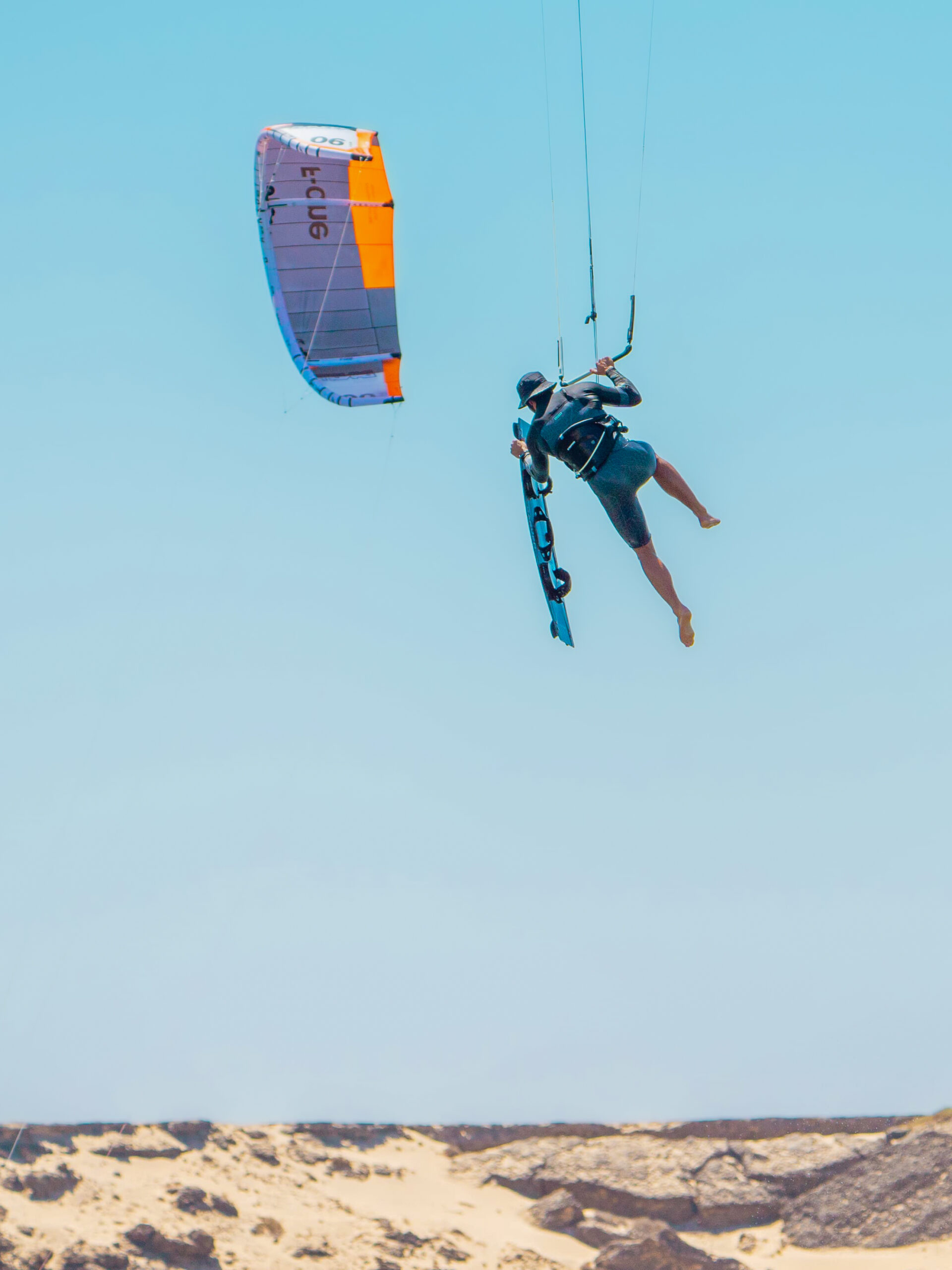 Kitesurf jump above the water during a wannawake session