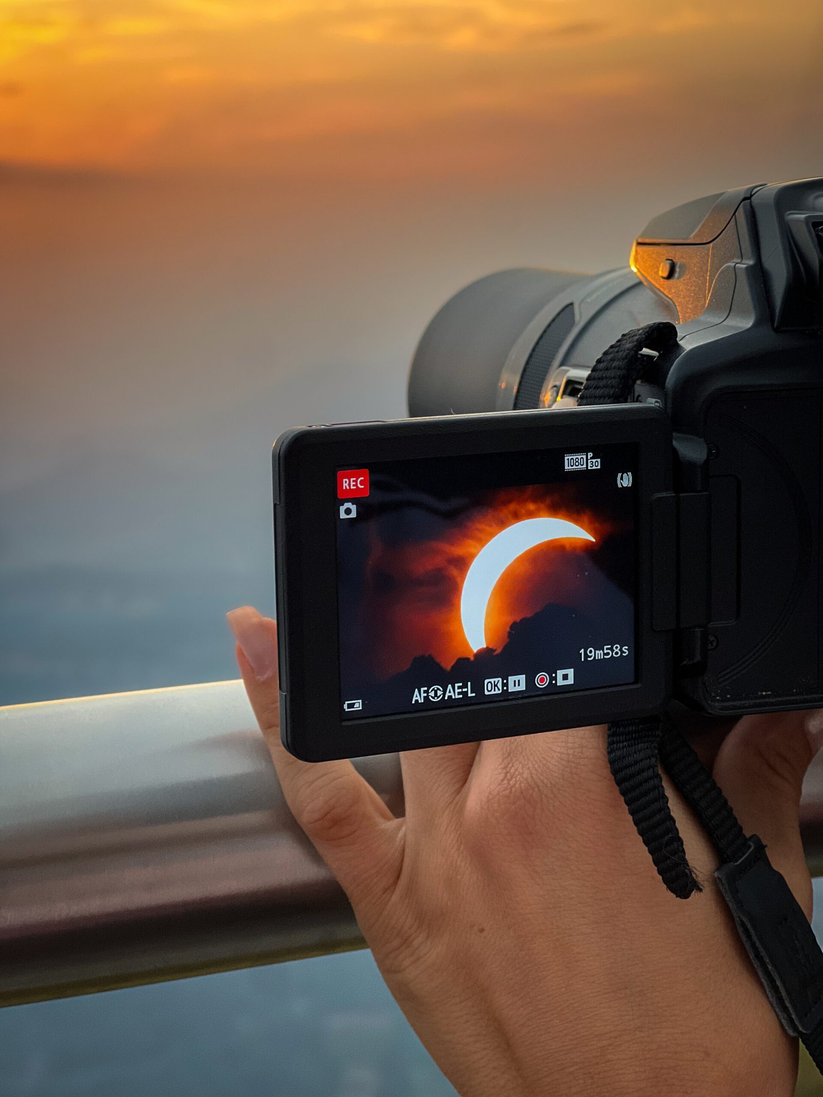 Camera recording the solar eclipse during the Eclipse 2026 sunset event on Monte Generoso, Ticino.