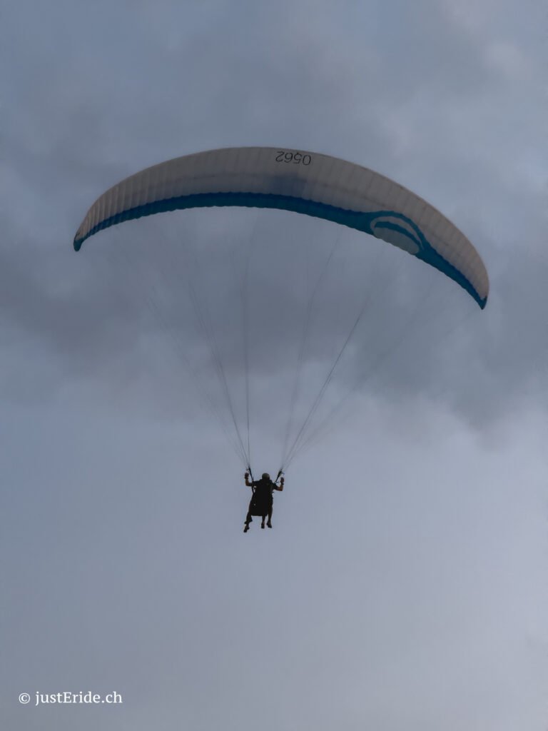 Luca flying tandem above Monte Generoso during the Eclipse 2026 sunset shuttle event in Ticino.